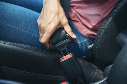 woman-hand-fastening-seatbelt-in-the-car-cropped-image-of-woman-sitting-in-car-and-putting-on-her-seat-belt-safe-driving-concept